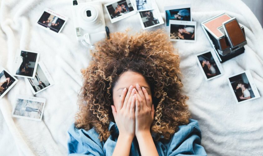 A young person resting their head amid scattered papers — Fetal Alcohol Spectrum Disorder (FASD) often makes memory and recall harder in the classroom